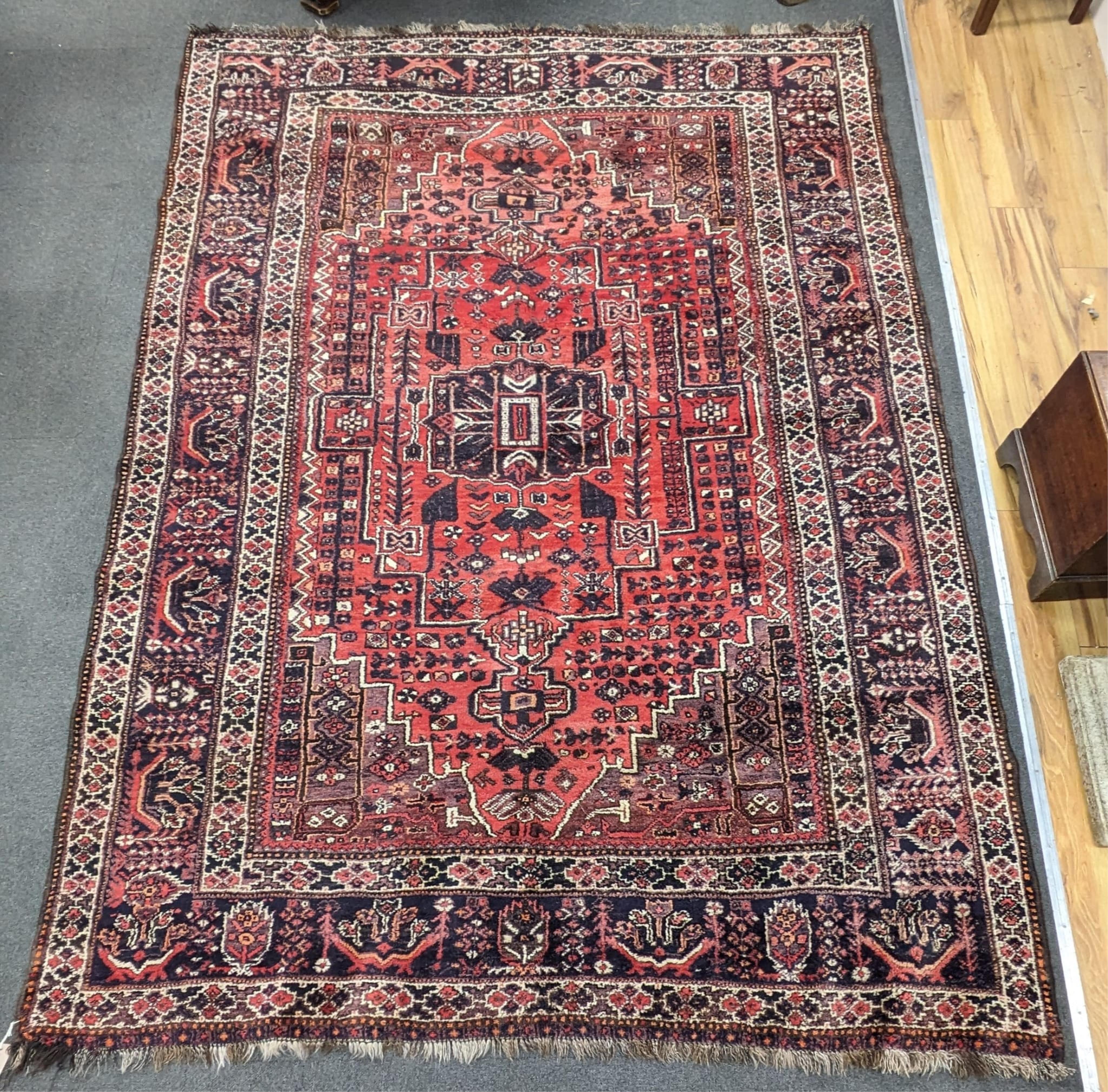 A Persian Shiraz carpet, 300 x 210cm